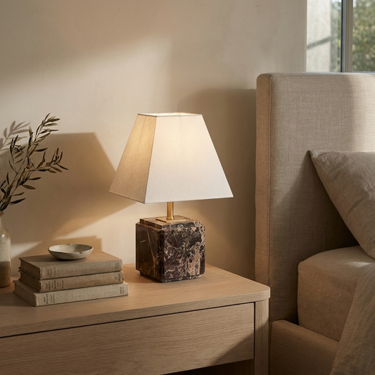 Fatima stepped marble table lamp with linen shade in a warm neutral interior
